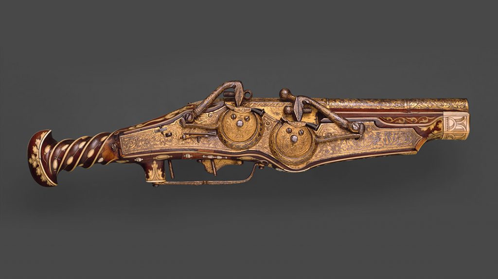 One of the earliest double-barrel pistols, this firearm was designed and produced by Peter Peck—maker of watches and guns. The two locks combined in one mechanism provided the barrels with separate ignition. Made for Emperor Charles V (reigned 1519–56), the pistol is decorated with his dynastic and personal emblems. It includes a double-headed eagle and the Pillars of Hercules with the Latin motto PLUS ULTRA (More beyond). (Metropolitan Museum of Art)