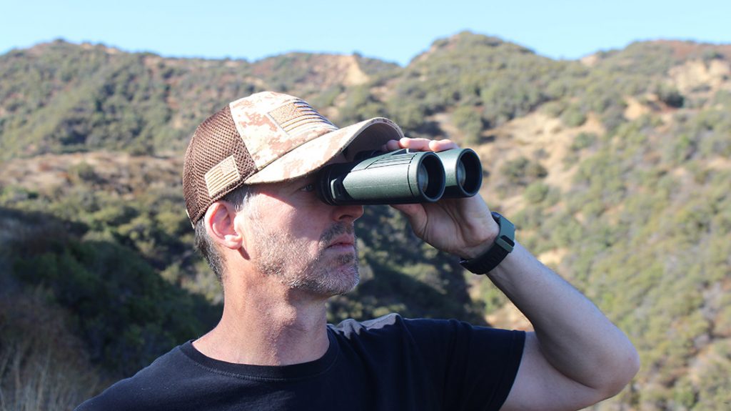 The author uses a pair of Hawke binoculars in the field.