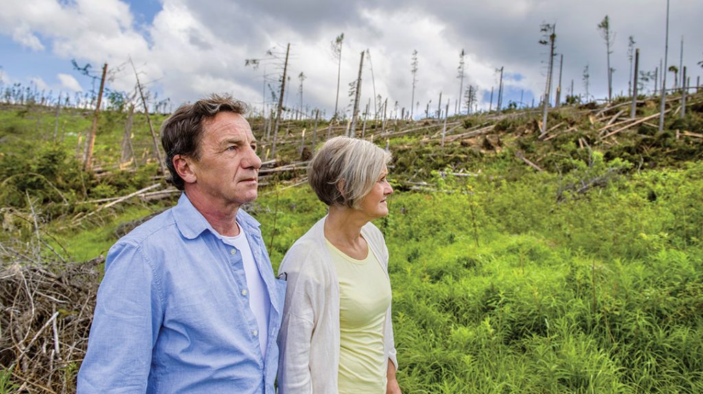 A couple overlook the aftermath of a natural disaster. Ensure your and your family’s survival with tips from the Mormon church.
