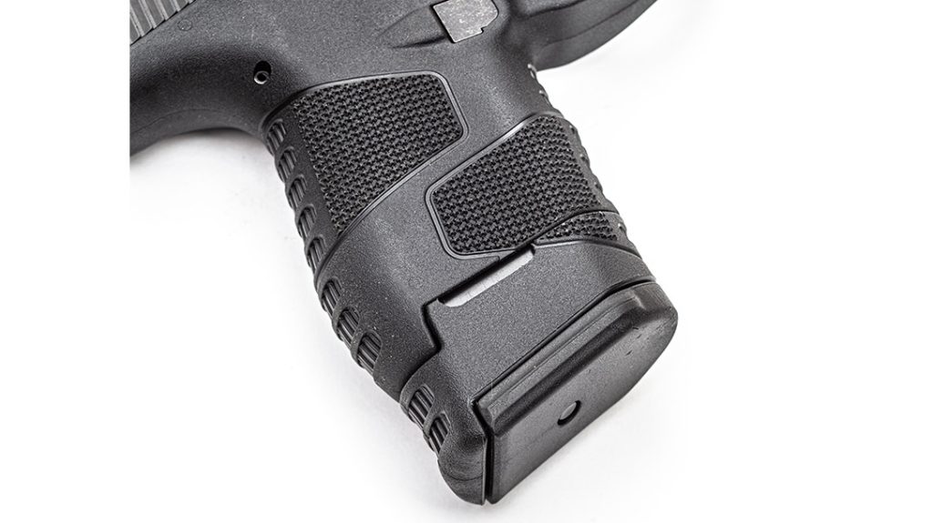 The extended magazine provides a nearly seamless full-size grip.