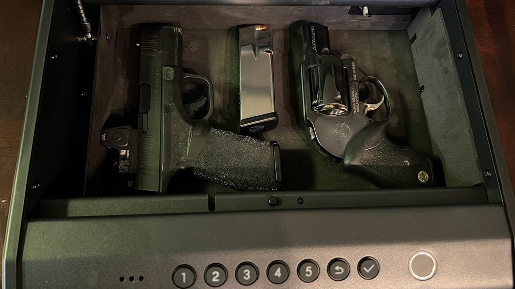 The Pineworld K5 gun safe comfortably fits my Springfield Hellcat Pro with Trijicon RMR and extra magazine, along with a Taurus 651 revolver.