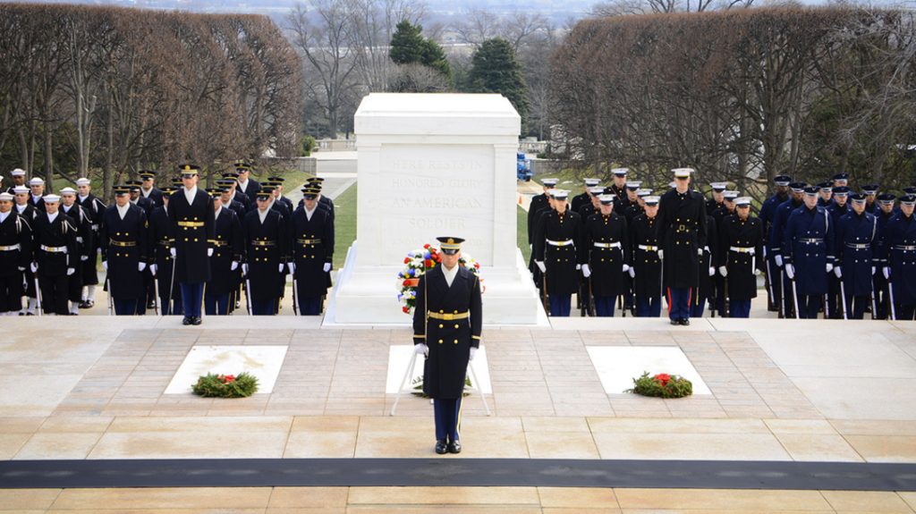 Army Old Guard soldiers guard The Tomb of the Unknown Solider at Arlington National Cemetery. 