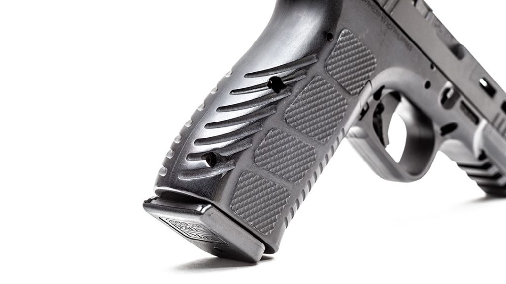 The grip frame of the pistol has a unique pattern of checkered panels and grooves that provide a comfortable and very secure grip.