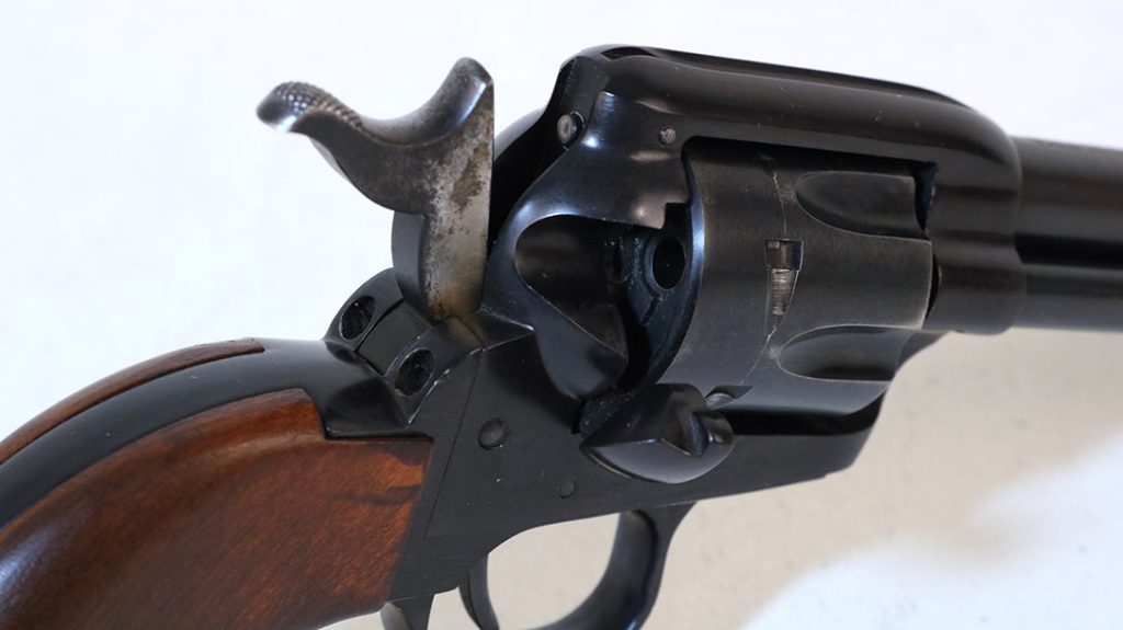 Unlike the original Colt Peacemaker, the Frontier Scout single action revolver utilized a transfer bar ignition system.