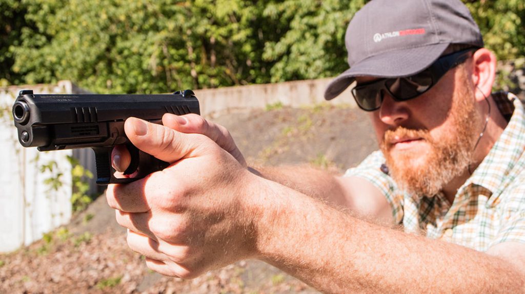The author shooting the Grand Power 9mm Q100.