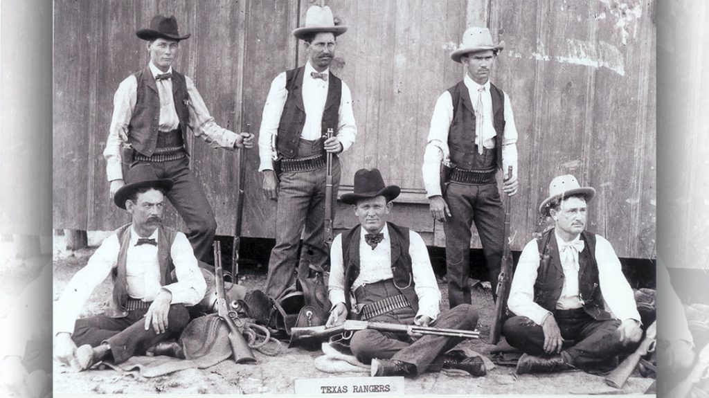 Texas Rangers armed with Colt Peacemakers and 1894 Winchester rifles and carbines. The rifle cartridges that fill the belts of these Rangers show which weapons were their primary arms. Note that the man on the left has .38-55 WFC cartridges in his belt, while the others appear to have the more popular and flatter-shooting .30-30 WCF.
