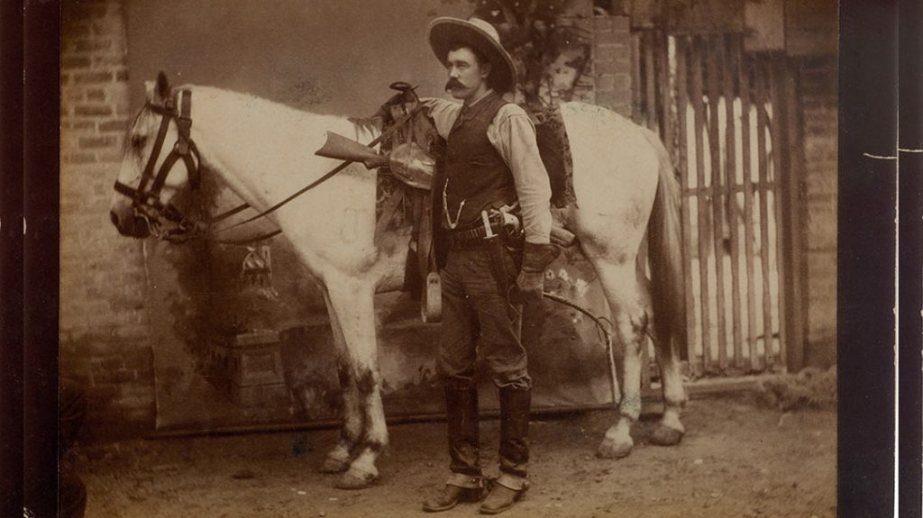 Texas Ranger Walter Durbin, equipped for duty with his Frontier Battalion, packs the tools of his trade: rifle, pistol and knife. The long 1876 custom Winchester in his saddle scabbard would have been awkward to draw when mounted, but his cross-draw-holstered pistol was quick to deploy.