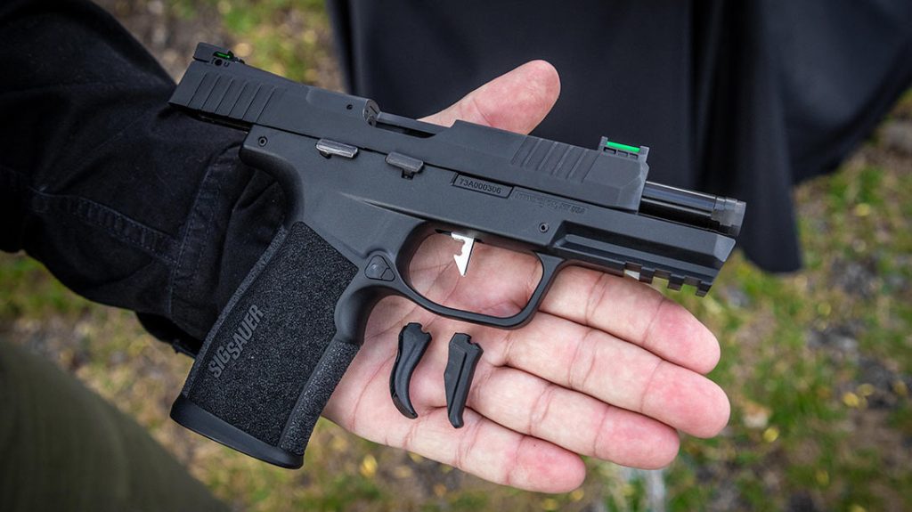 The pistol comes with two triggers—curved and flat—that can be easily swapped out.