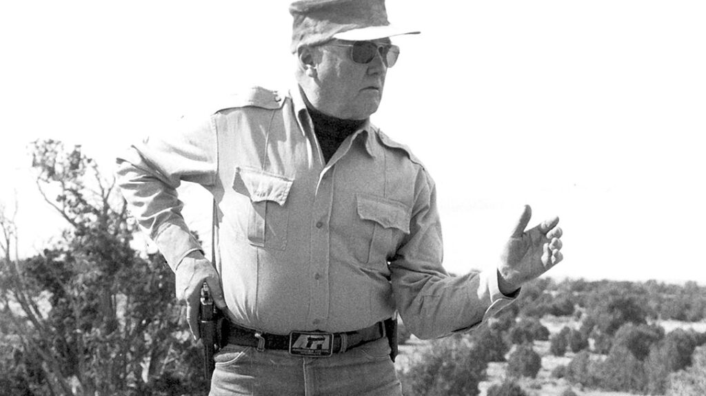 Colonel Jeff Cooper carrying his 1911 in a Yaqui-style minimalist holster.