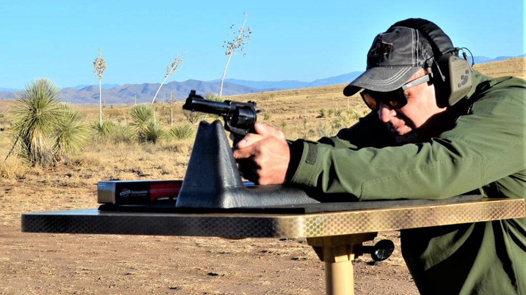 The author shoots the TGW custom Ruger Blackhawk from the bench.