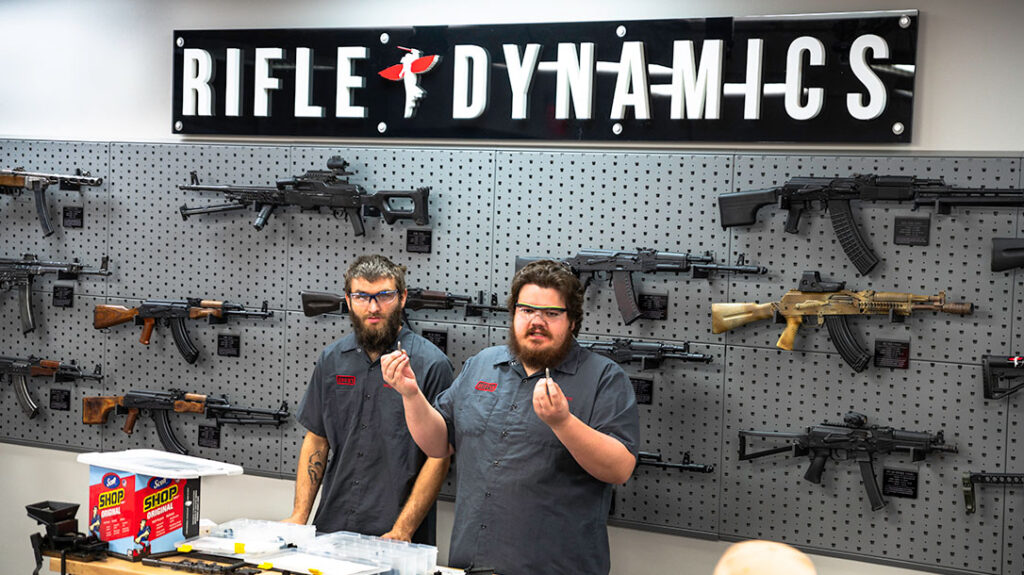 Jeromy and Austin, both staff at Rifle Dynamics, give the class instruction on the next step of the AK build process.