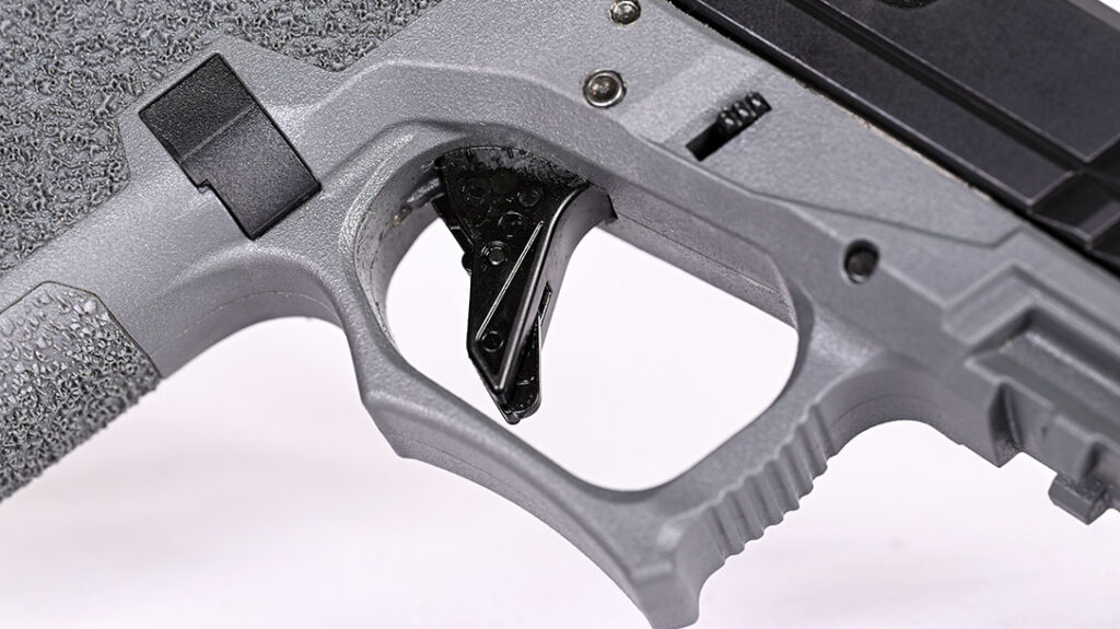 Featuring a blade safety the author selected the flat faced trigger for his 80% receiver build.