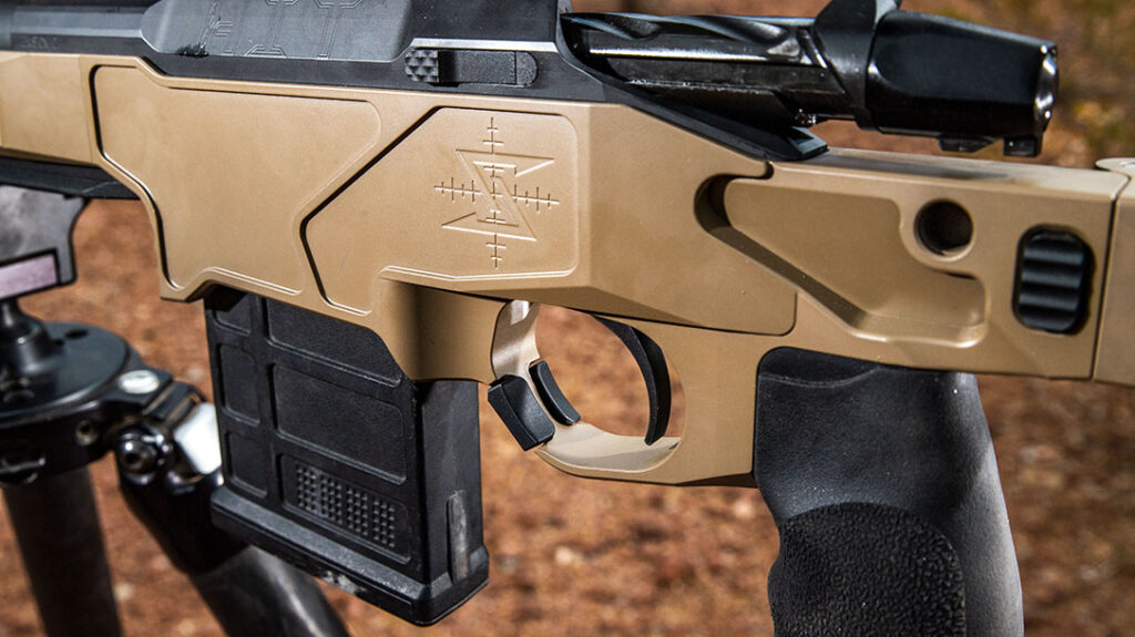 The adjustable mag release resides integrated with the triggerguard.