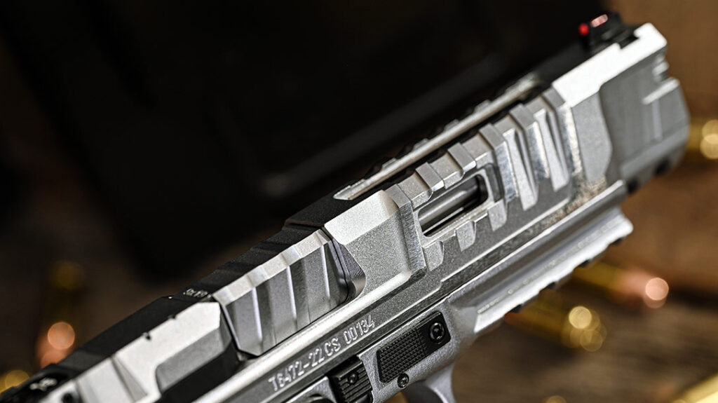 The barrel and aggressively serrated slide are the same ones used on the original pistols.