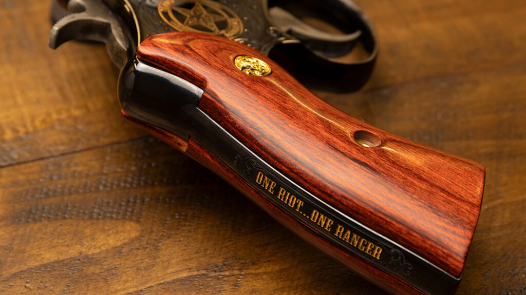 "One Riot, One Ranger," the Texas Ranger slogan, is engraved on the pistol. 