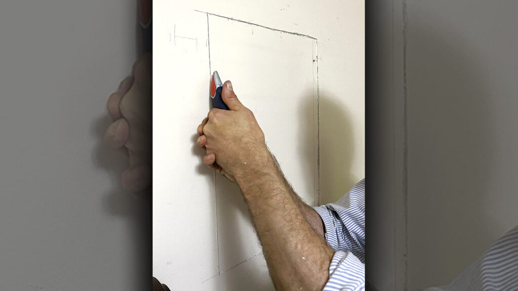 A sharp utility knife and several careful passes are all that’s needed to cut through typical residential wallboard.