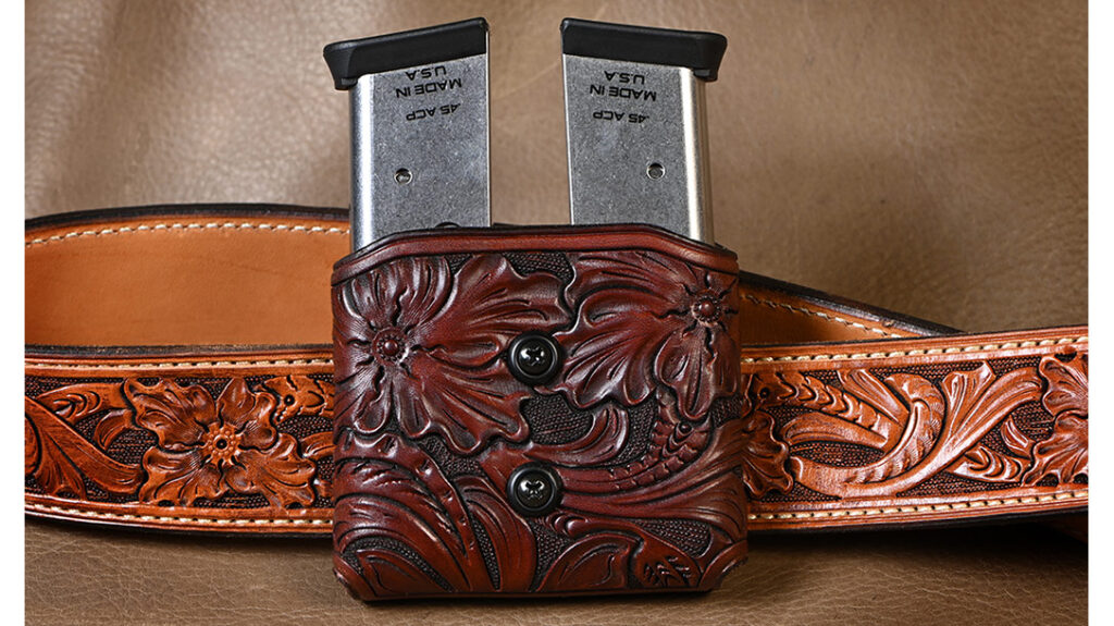 He made a custom A.W. Brill-style holster and a double magazine pouch.
