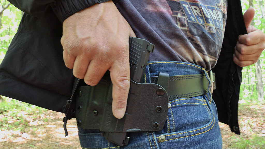 The author running drills with the holster in OWB format.