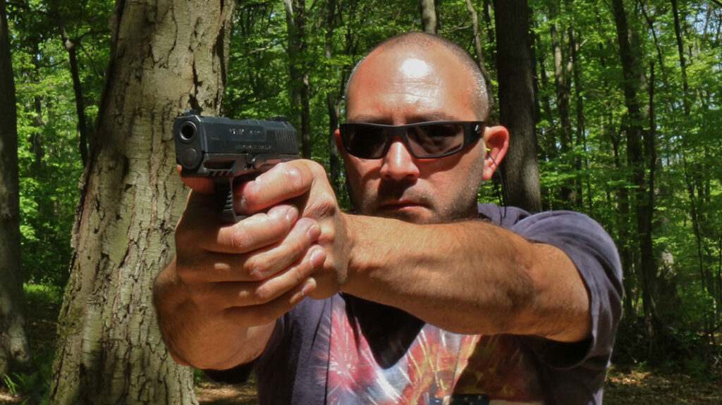 The author shooting the Canik METE MC9 Micro-Compact.