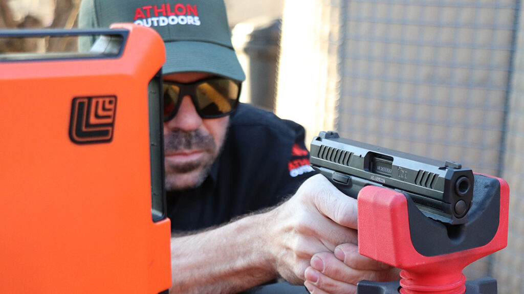 The author shoots the firearm from the bench to test for accuracy.