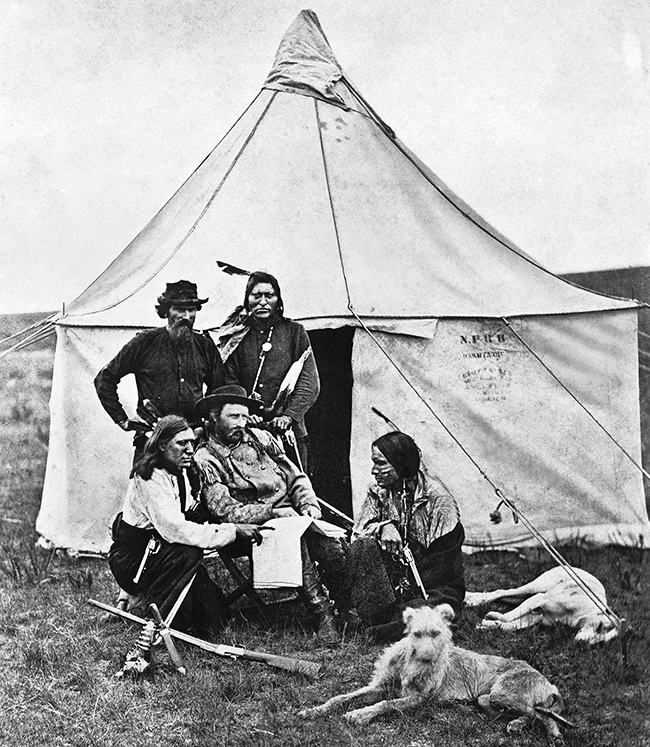 Custer with Native Americans and his dogs.