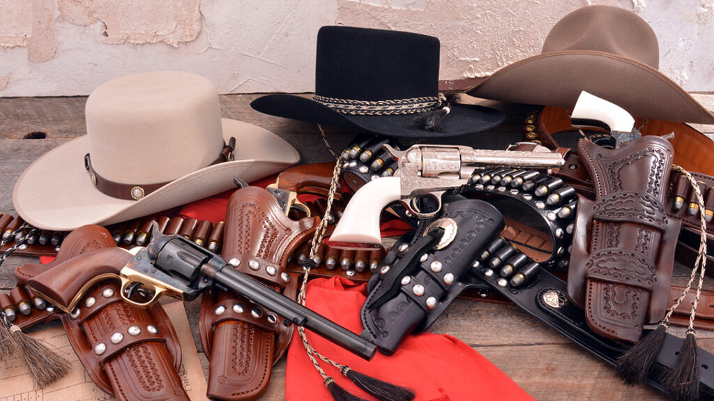 A collection of old west guns and gear.