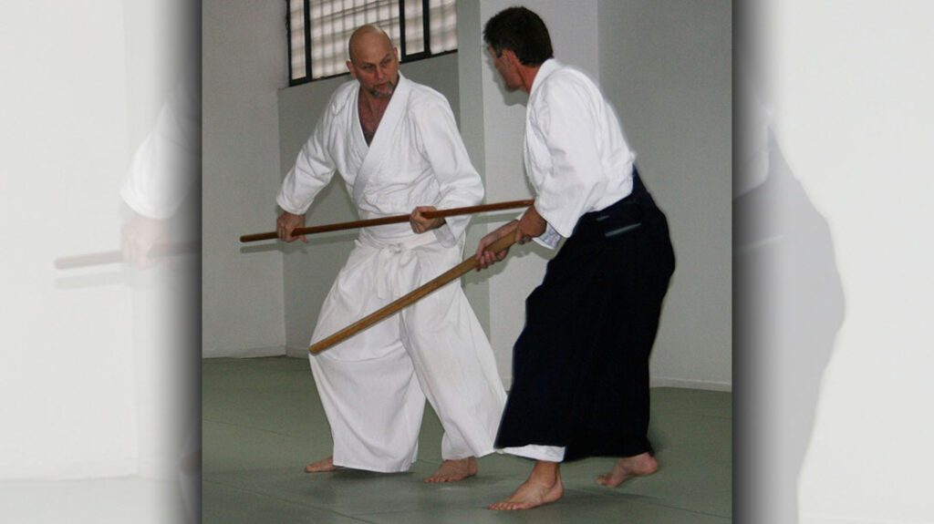 Ellis Amdur demonstrates a staff vs. sword technique from classical Japanese martial arts.