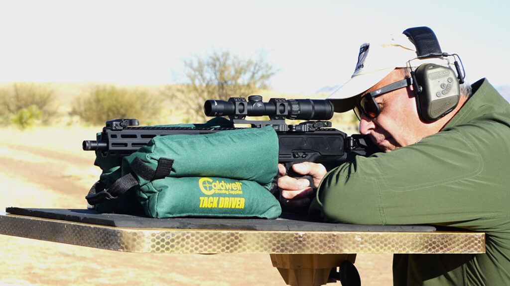 The author shooting the Ruger LC Carbine 45 from a bench rest.