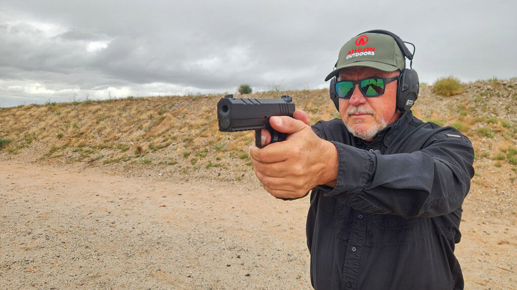 The author shooting the Springfield Armory All-Black Emissary.