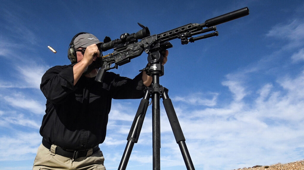 Shooting long-range rifle targets using a tripod. 