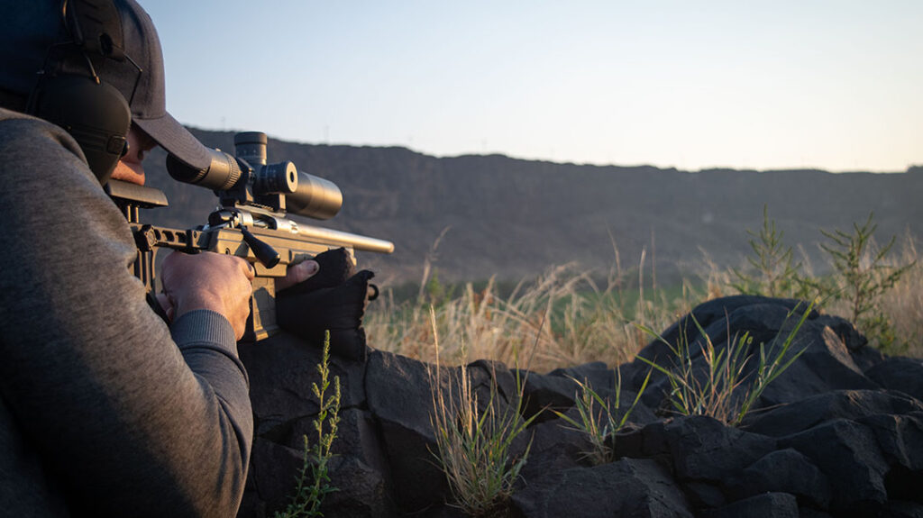 Shooting long-range rifle targets in the field. 