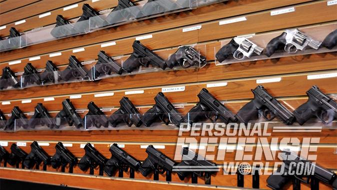 wall of handguns in a gun shop