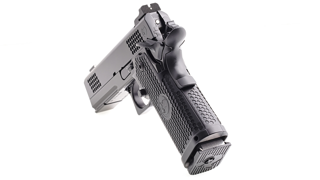The pistol features dimples for non-abrasive, snag-free grip.