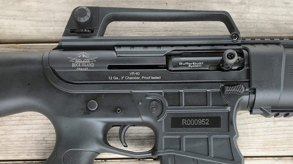 The right side of the VR60 receiver shows it uses a magazine catch like the one on an M4. It also has an A2-type removable carry handle, and the charging handle is attached to the bolt itself.
