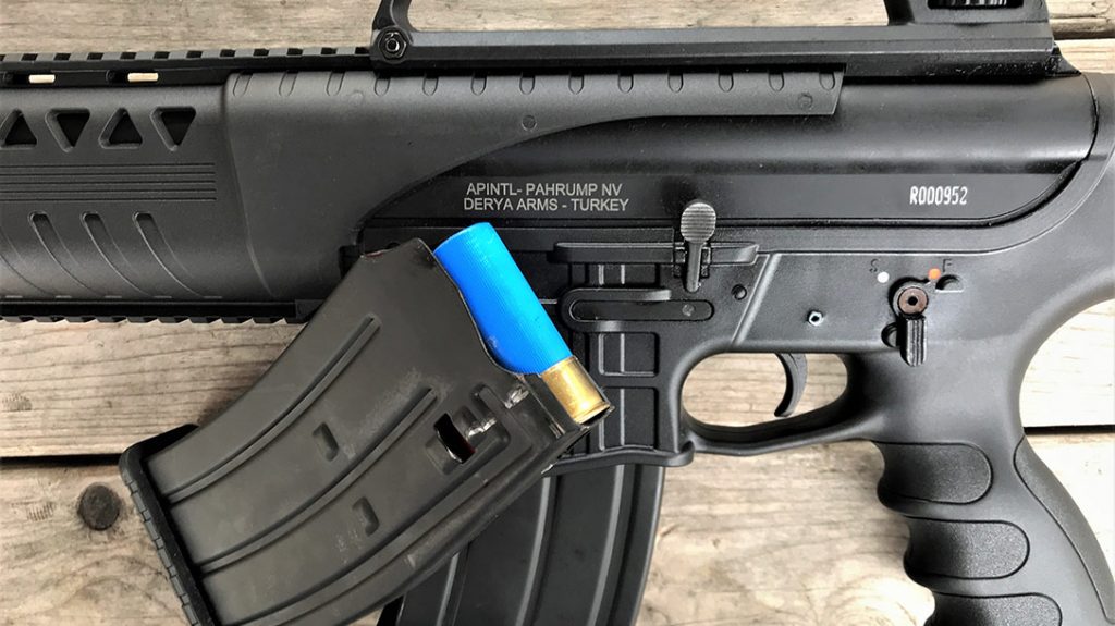 This left-side receiver view shows the AR-like safety and bolt release latch. The AR-style box magazine holds five shotshells.